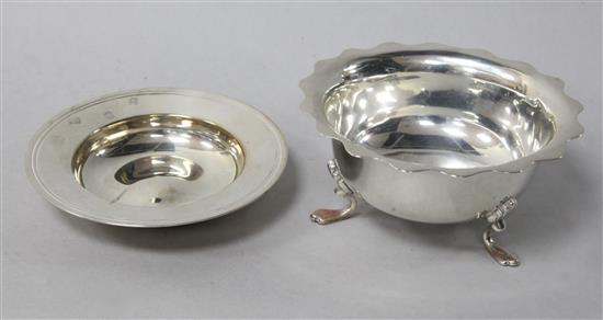 A George V silver sugar bowl with waved rim, and a modern silver alms dish.